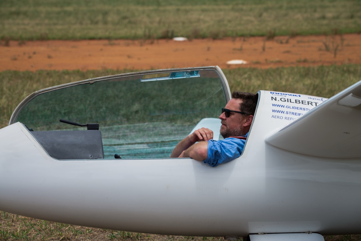 Nick Gilbert in the cockpit of a glider on the airfield